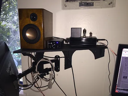 A shelf to fit a wall-mounted monitor.