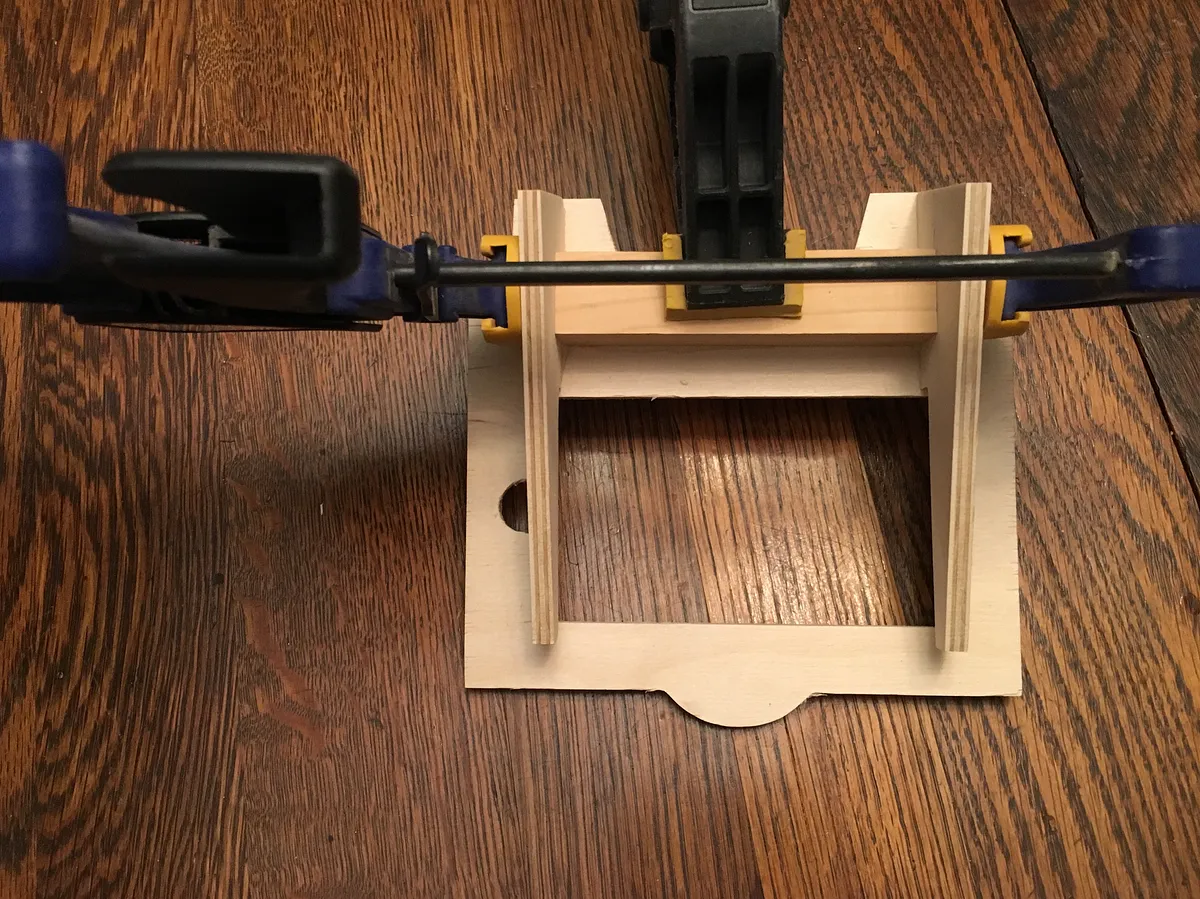 iPhone TV Stand — Attach legs and check phone fit