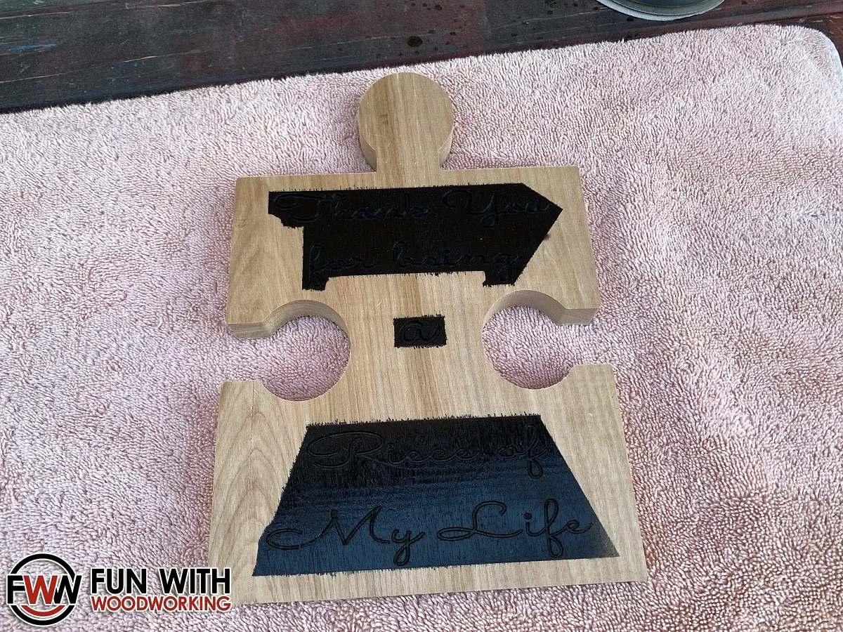 Puzzle piece plaque — Sand off the excess paint